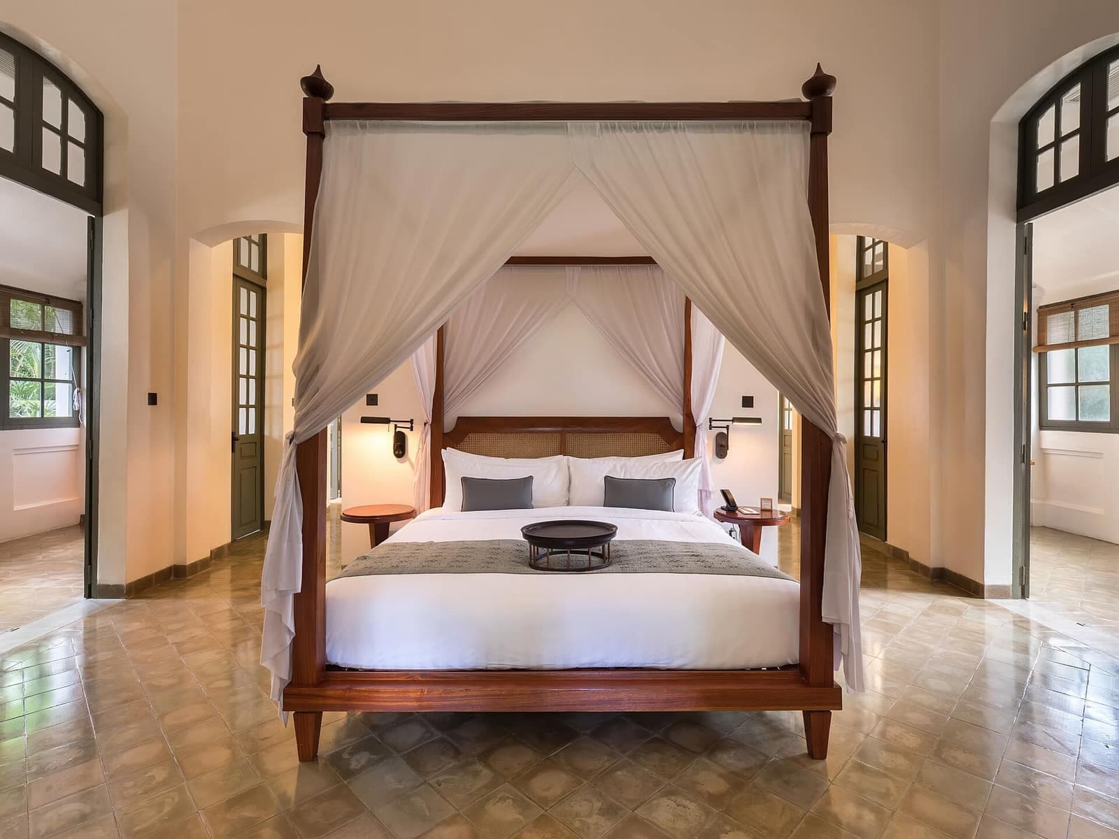 A luxurious canopy bedroom in a property sold discreetly