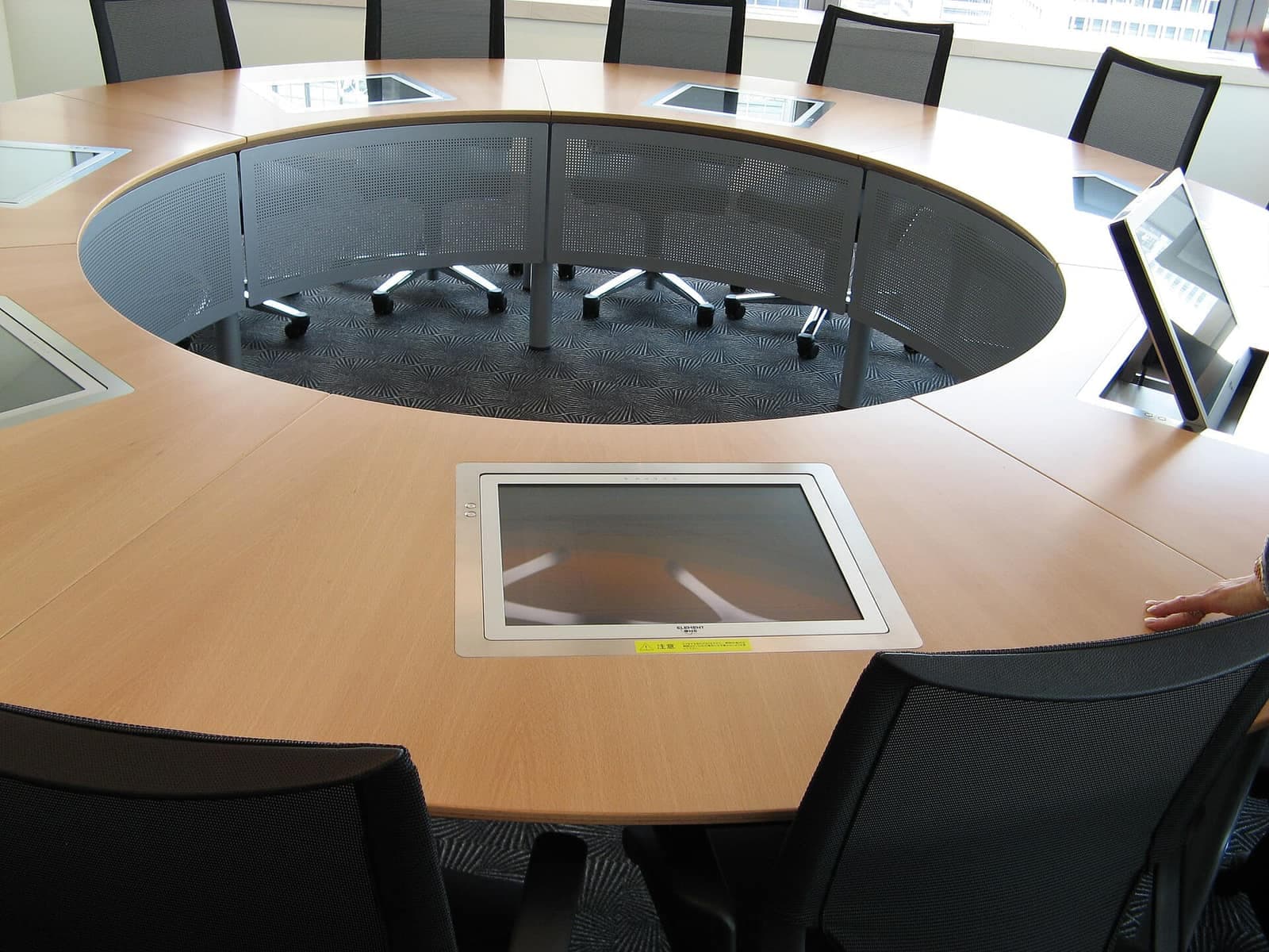 A consultation across the table — an agent talking a client through their options